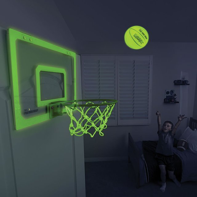 SKLZ Pro Mini Hoop Midnight Hoop and Ball – $34.99
Shoot hoops late into the night with the SKLZ Pro Mini Hoop™ Midnight Hoop and Ball. Featuring an 18″ x 12″ clear, polycarbonate shatterproof backboard and a spring-action, breakaway steel rim, the set offers a durable source of fun for your office, bedroom or dorm. The glow-in-the-dark nylon net and 5″ mini basketball allow for low-light play. Foam-padded to enable quiet play. Door brackets with a slide-on design for easy mounting.