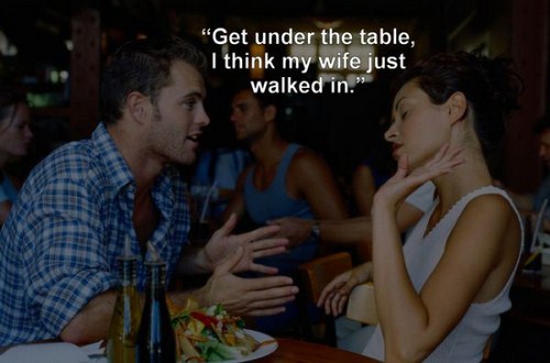 couple fighting on a date - Get under the table, I think my wife just walked in."