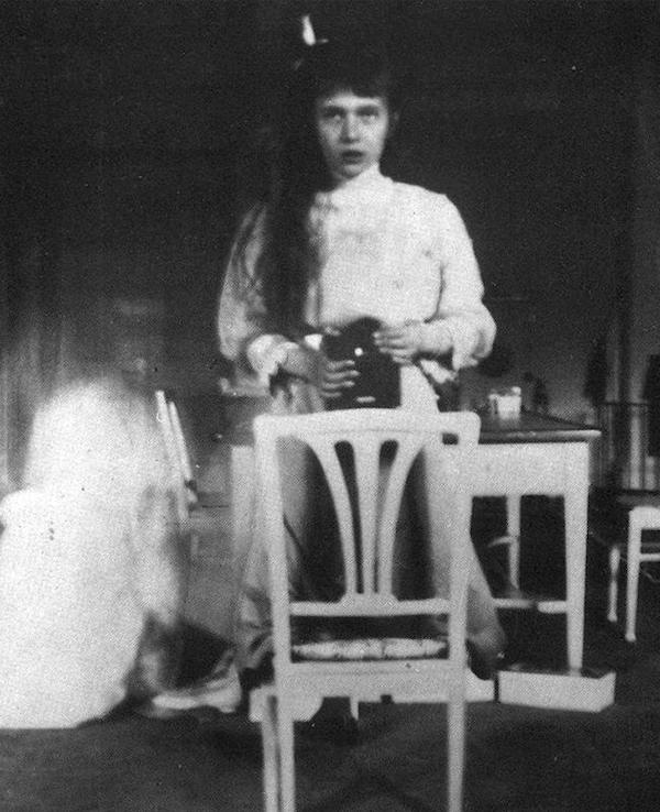 Grand Duchess Anastasia...The above photo was snapped by the  in 1913, when she was a teenager. The youngest daughter of Russia's last czar is using the wildly popular camera of her time—the Kodak brownie, released in 1900—and a mirror to capture her own likeness.