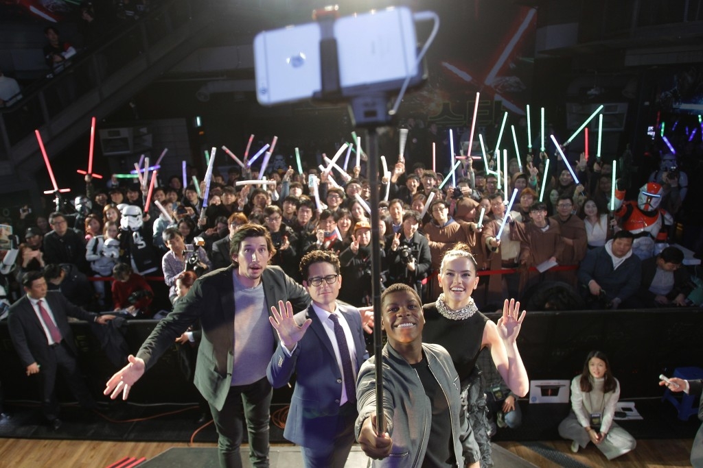 J.J. Abrams and actors from Star Wars take a selfie during an event for The Force Awakens in Seoul, South Korea.