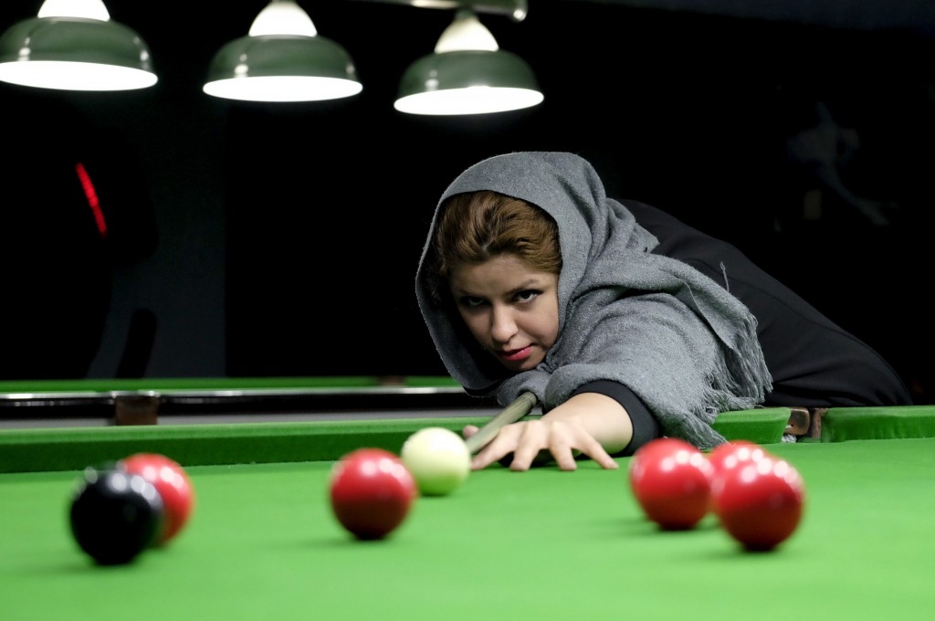Iranian women's snooker champion, Akram Mohammadi Amini, plays a shot during a practice session in Karaj.