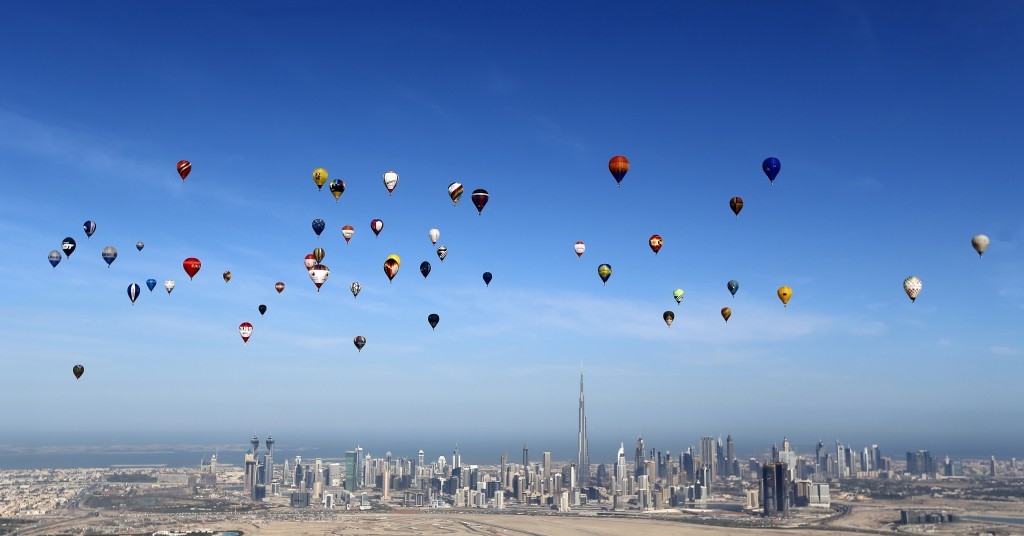 Hot air balloons fly over Dubai during the World Air Games 2015.