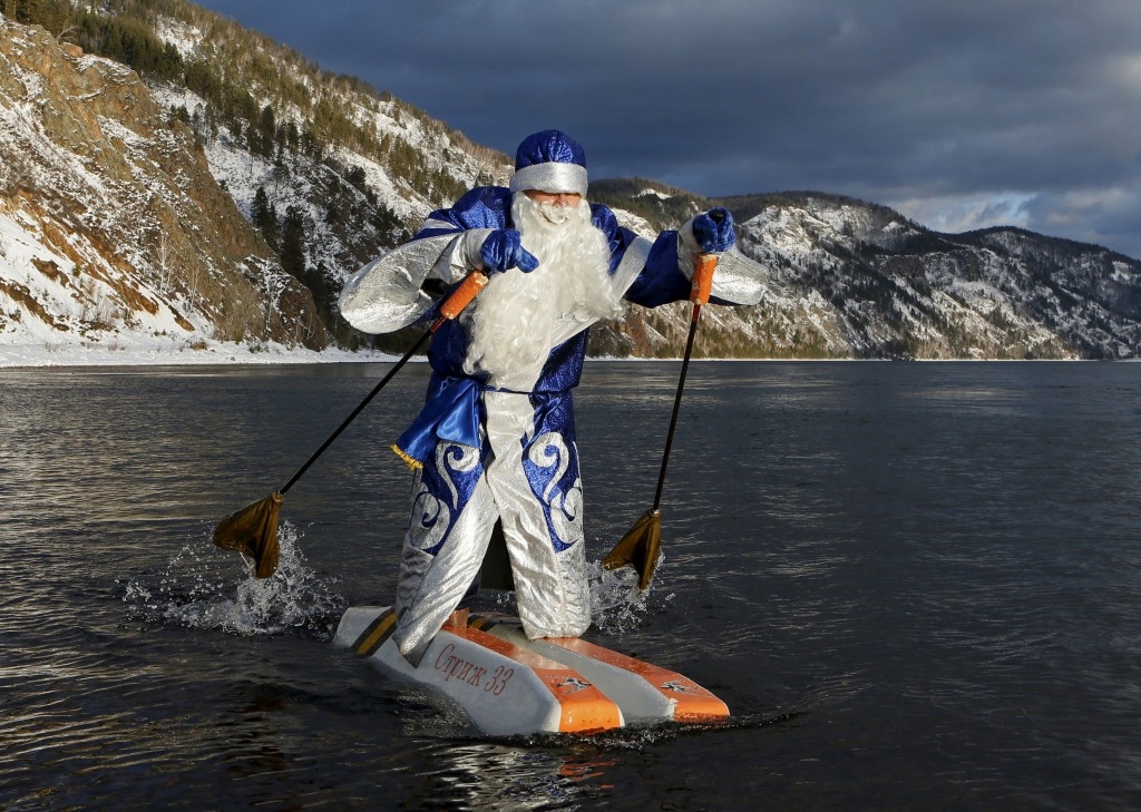 Nikolai Vasilyev, dressed as Father Frost, the Russian equivalent of Santa Claus, water-skis along the Yenisei River in Krasnoyarsk, Russia.