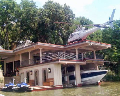 house with boat and helicopter