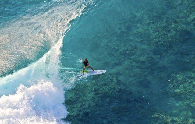 surfing in french polynesia