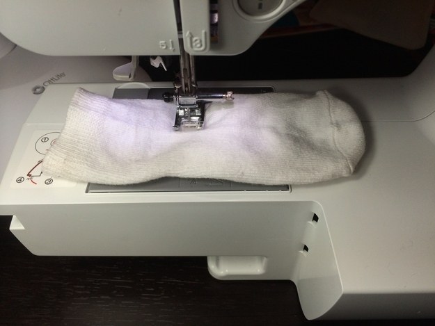 Get out the needle and thread and sew one of their socks closed halfway down.