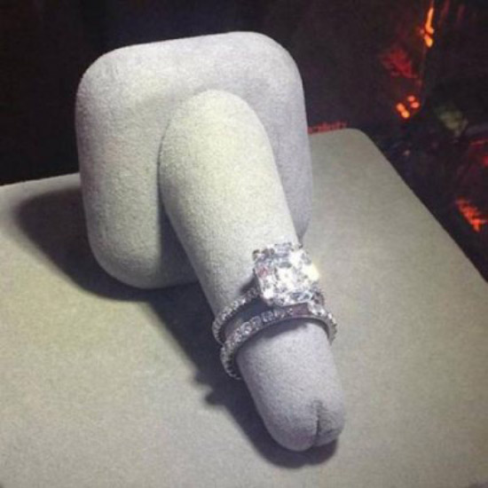 Funny picture of diamond ring on display on what appears to be a felt penis