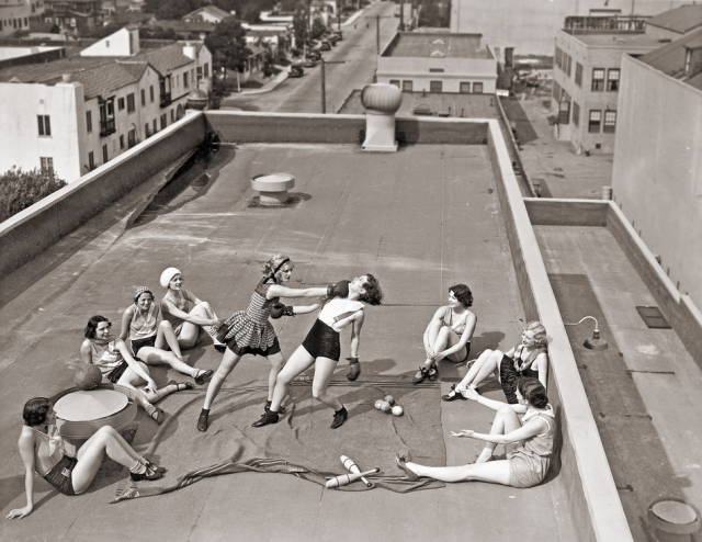 women boxing on a roof - Ola