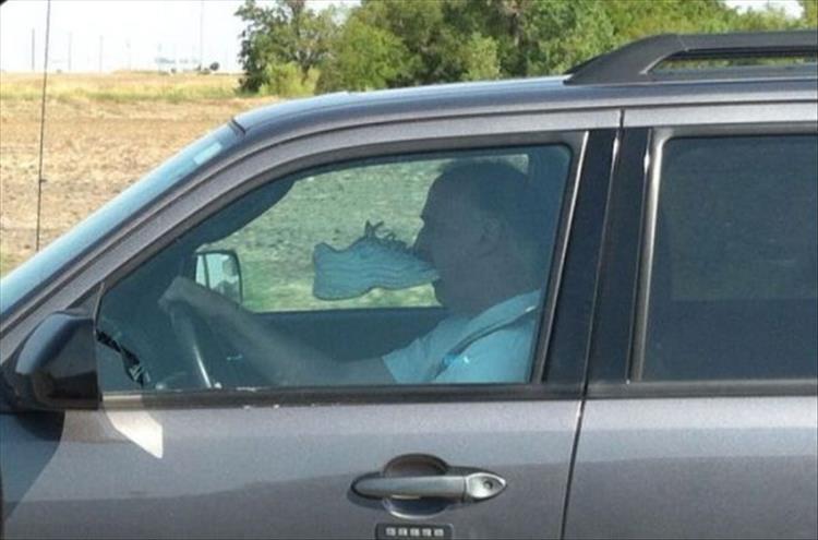 guy eating shoe in car