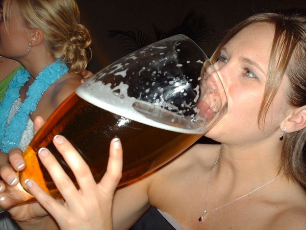 woman drinking big beer