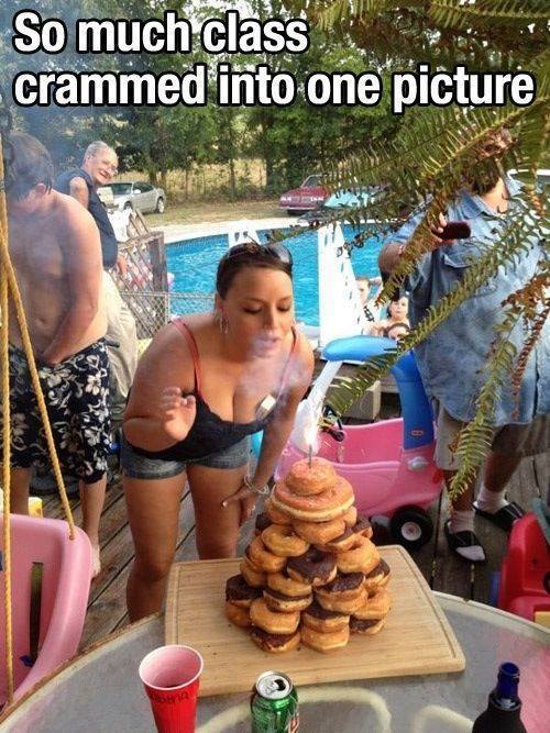 Woman wearing trashy outfit blowing out the candles of her birthday donut pile as she holds a cigarette off to the side an an older gentleman checks her out as she bends over.