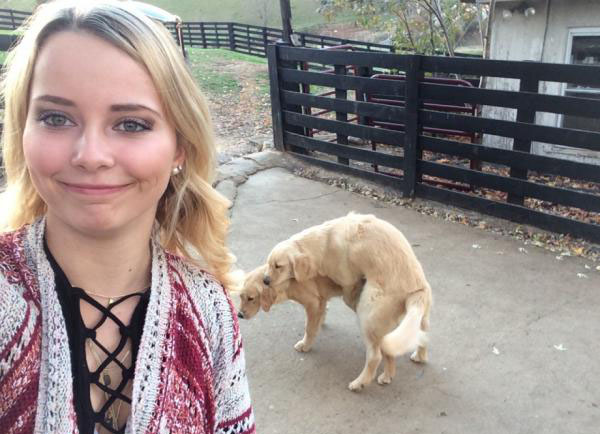 Dog pooping in a woman's selfie
