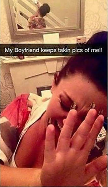 Snapchat meme of a woman trying to pose like her boyfriend won't stop photographing her, but sadly she is alone at home as the mirror behind her shows us.