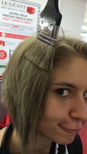 Funny picture of a girl that has the same hair color as that brush.