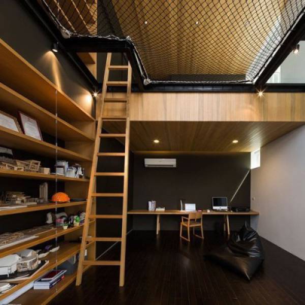 Awesome configuration of a studio with a net overhead for sleeping on.