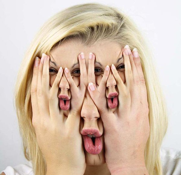 Funny picture of girl with many faces photoshopped onto her face.
