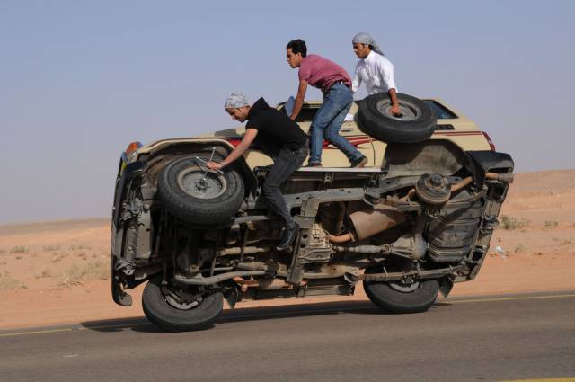 stupidity changing tires on a moving car