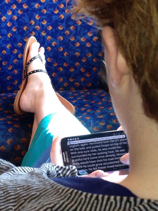 Someone reading a smutty novel on their smartphone