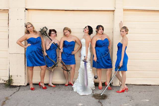 Cringeworthy pic of bride and bridesmaids all holding swords
