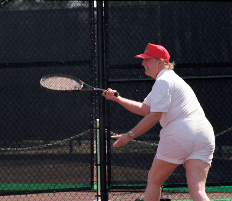 Donald Trump playing tennis wearing all white and not a faltering image at all.