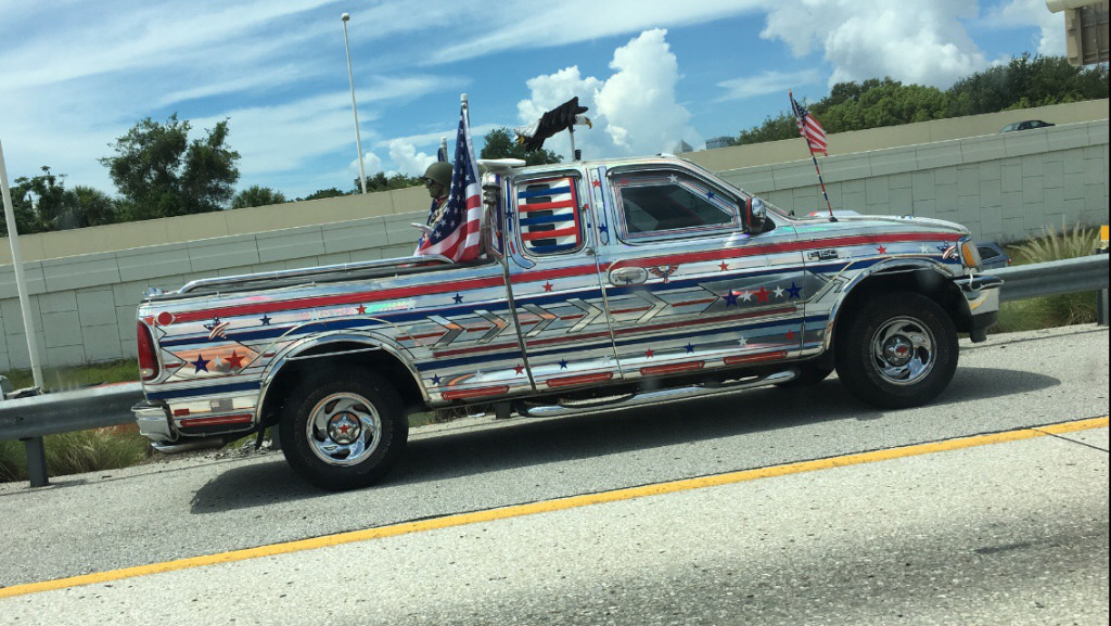 dude in a stainless steel pickup truck that is pure 'Murica
