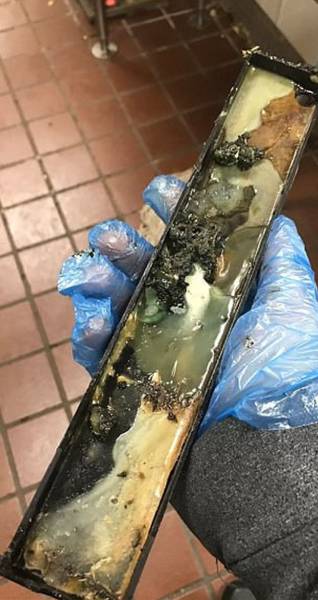 image shows a metal tray that he claims came out of one of the chain's ice cream machines - and it appears to be full of green gunk.