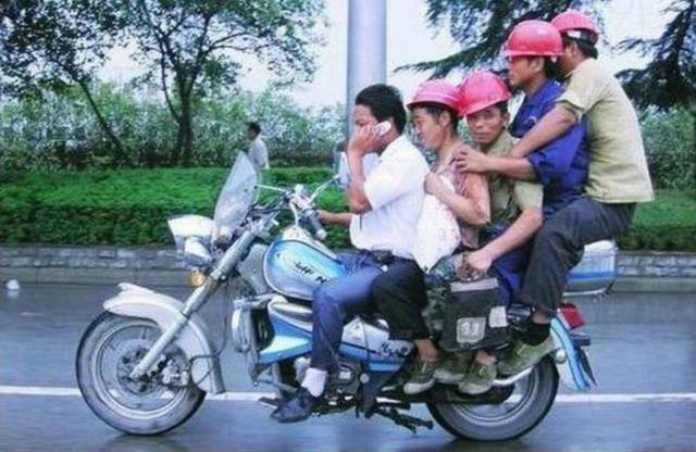 5 guys on a motorcycle