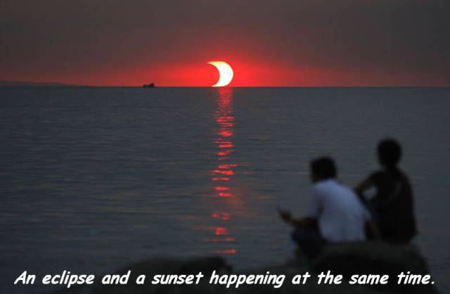 cool pic sky - An eclipse and a sunset happening at the same time.