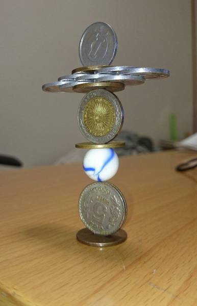 amazing picture of coins and marble balanced together