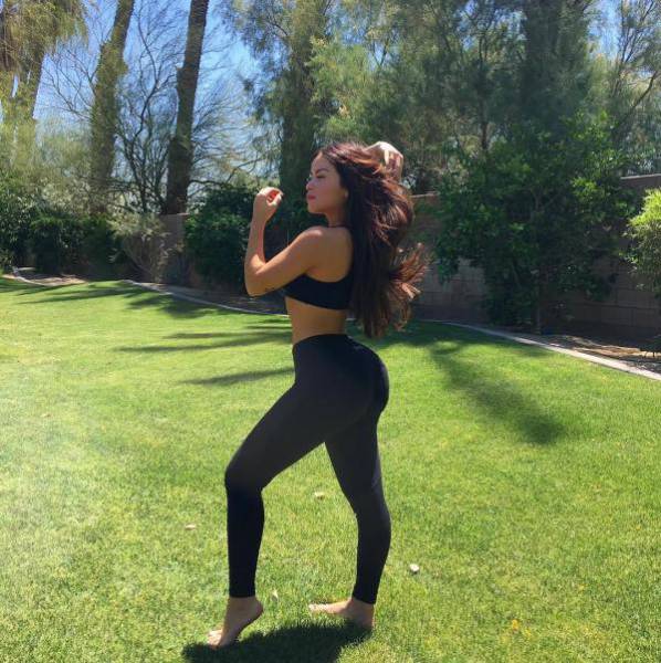 Girl dancing in the park with yoga pants