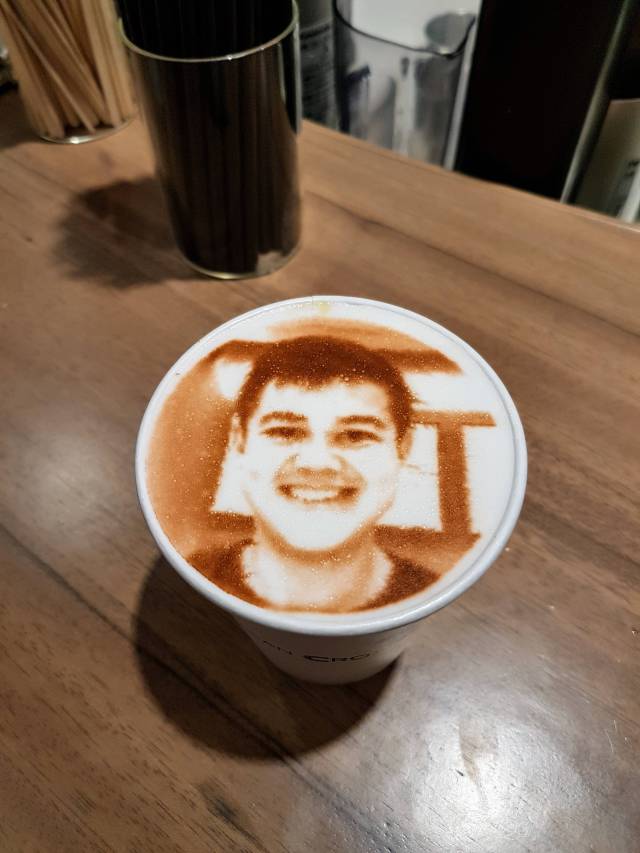 Face scanned onto the top of a cup of coffee