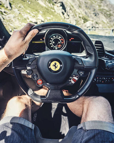 Driver seat view of driving a Ferrari