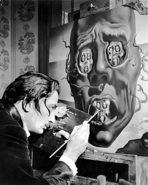 Dali finishing up one of his paintings.