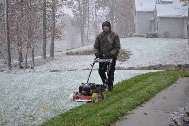 mowing grass in snow