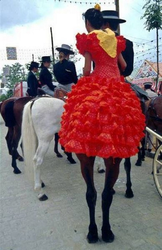 Woman with dress on a horse that is an optical illusion that looks like a Pegasus