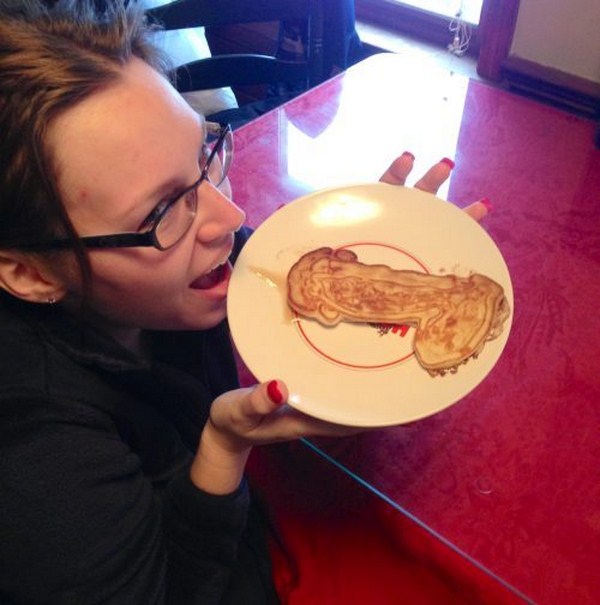 woman eating penis shaped pancakes