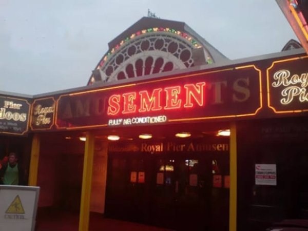 Amusements neon sign with the worst combination of busted letters