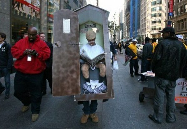 Man dressed in costume of an occupied porta potty