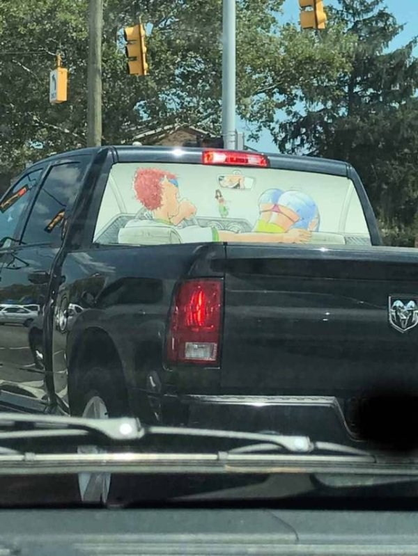 Artistic mural on the backwindow of a pickup truck