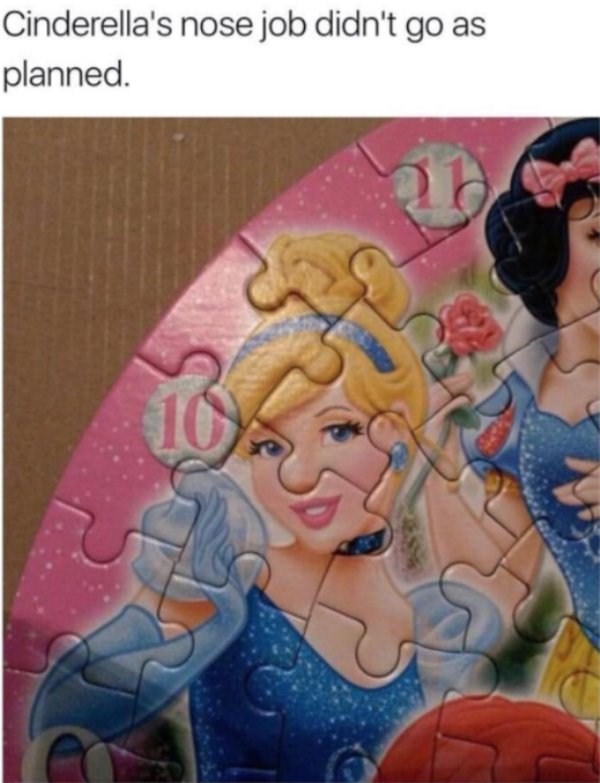 Funny picture of a Disney puzzle in which Cinderella's nose looks huge because of the puzzle piece's outline.
