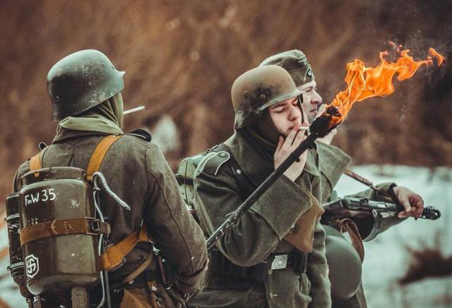 german soldier lighting cigarette with flamethrower - FmW 35