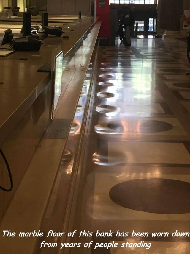 things worn down over time - The marble floor of this bank has been worn down from years of people standing