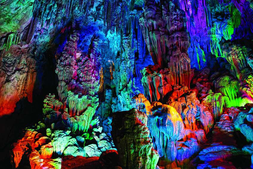 Forgotten for 1,000 years, the Reed Flute Cave in China was discovered by Japanese refugees during World War II. Later, ink writing was found in the caves dating back to 792 CE. However, it’s the multi-colored stalagmites and stalactites that make it a true wonder to behold.