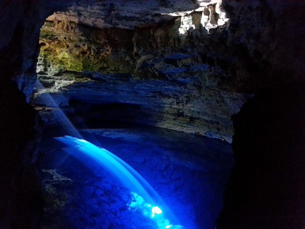 Poço Encantado, located in Brazil, is famous for its geological wonder known as the Enchanted Well. The pool of water in the cave hit by the sunlight creates a gorgeous and radiant sight.