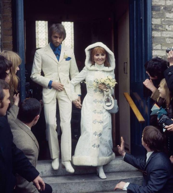 Maurice Gibb of the Bee Gees and Scottish singer Lulu pictured together after their wedding ceremony at St James's Church in England, 1969.