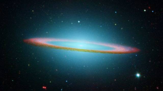 Sombrero Galaxy-One of the most photogenic images in our universe, the Sombrero Galaxy is roughly 28 million light years away from Earth. It’s not hard to see where it gets its name from, and scientists suspect that it probably has a super massive black hole at the center. The image you see is actually a mash up of several other images taken by both the Spitzer and Hubble Space Telescopes.