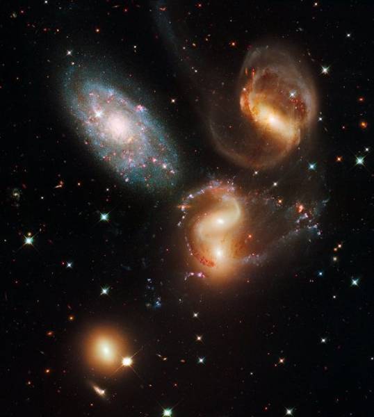 Galactic Wreckage-Known as Stephan’s Quintet, this group of galaxies appears to be constantly running into each other, making for some intense intergalactic stargazing