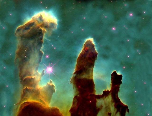 The Pillars of Creation-There are few things in this universe that can make you feel smaller than this now famous image of what has come to be known as the “Pillars of Creation.” An aptly named cloud of dust and gas, it is responsible for the birth of millions of new stars and can be found 6,500 light years away from Earth. Each one of those gaseous arms you are looking at are in fact trillions of miles long.