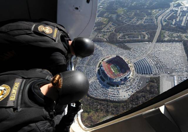 great picture of skydivers over a stadium