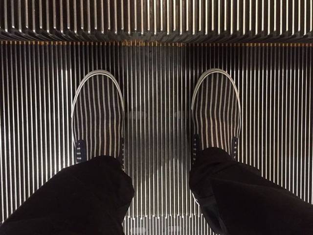 escalator with shoes that match pattern